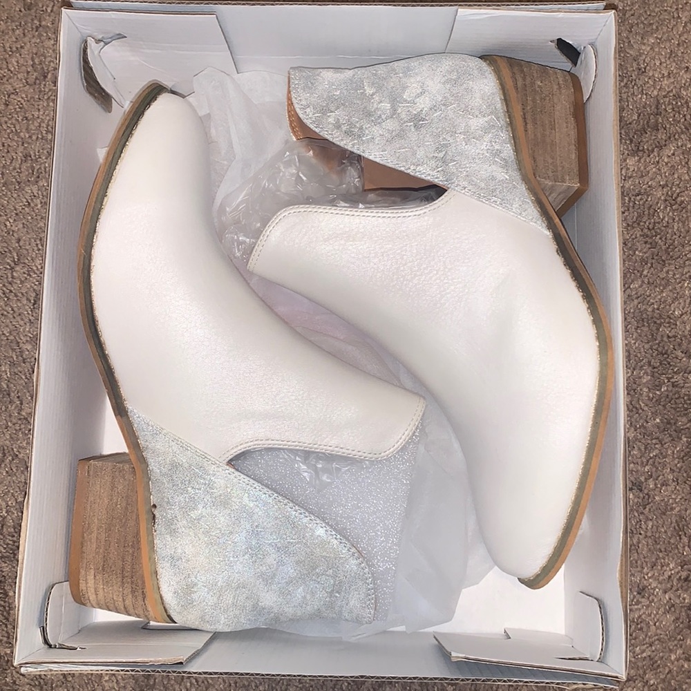 Corky’s white and silver star shoes